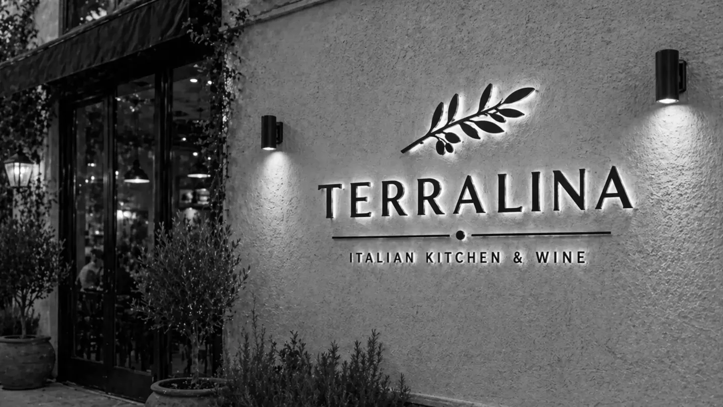 outdoor signage for an Italian restaurant featuring black 3D backlit letters with logo